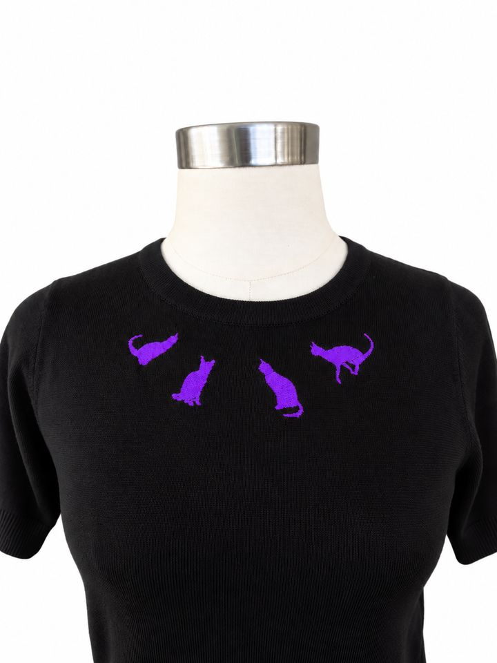 Hemet purple cat embroidered black knit top on white background