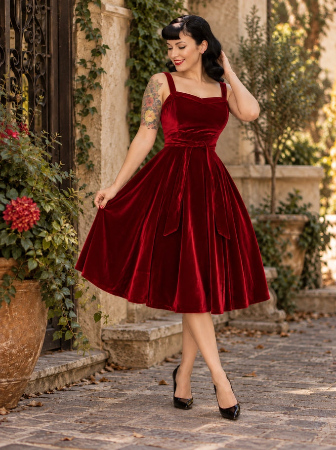 Hemet red velvet 1950s swing dress with sweetheart neckline, waist tie and full circle skirt, front view
