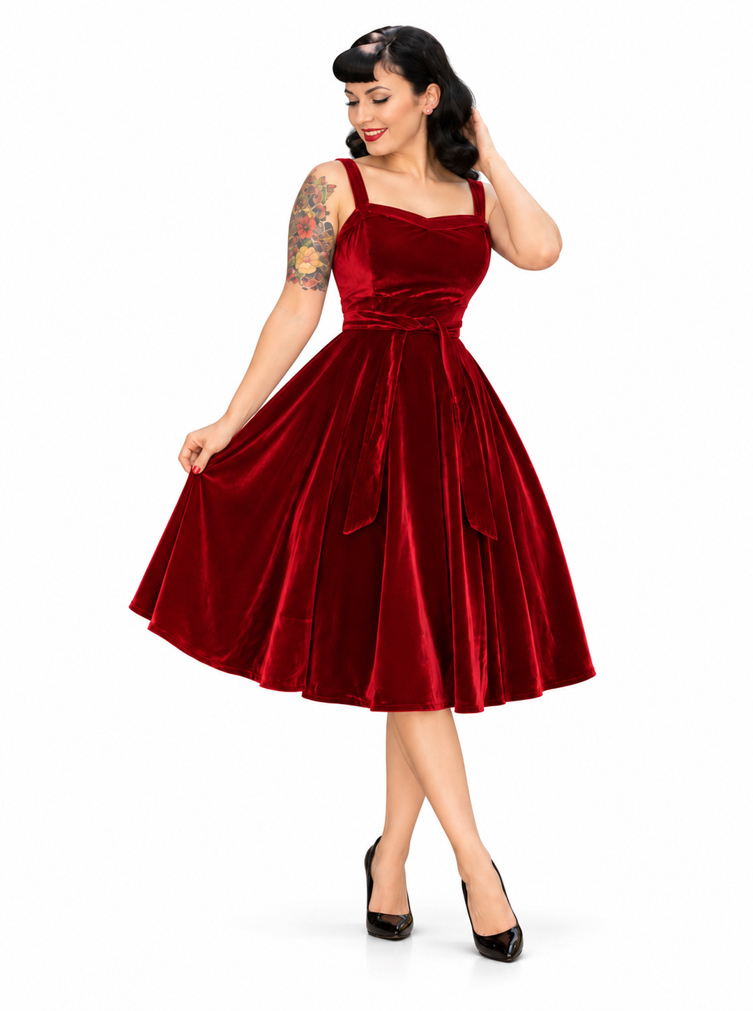 Hemet red velvet 1950s swing dress on white background with sweetheart neckline, waist tie and full circle skirt