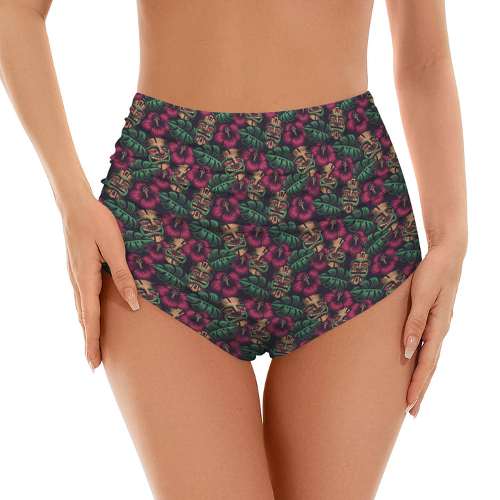 Leilani high waist bikini bottom featuring vibrant tiki-inspired floral print in tropical colors.
