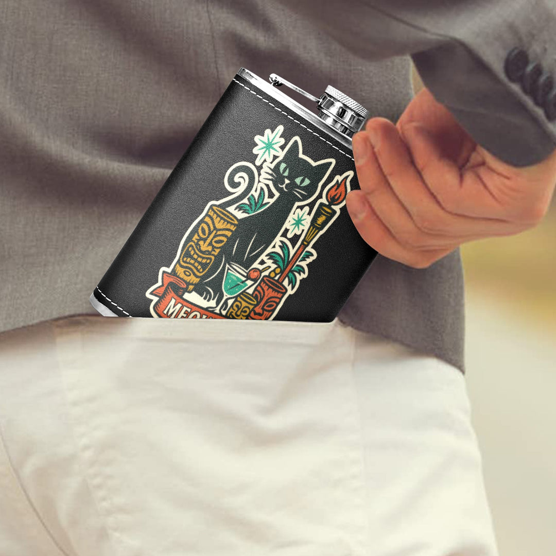 Close-up of a black hip flask with a cat design being placed into a man's back pocket.