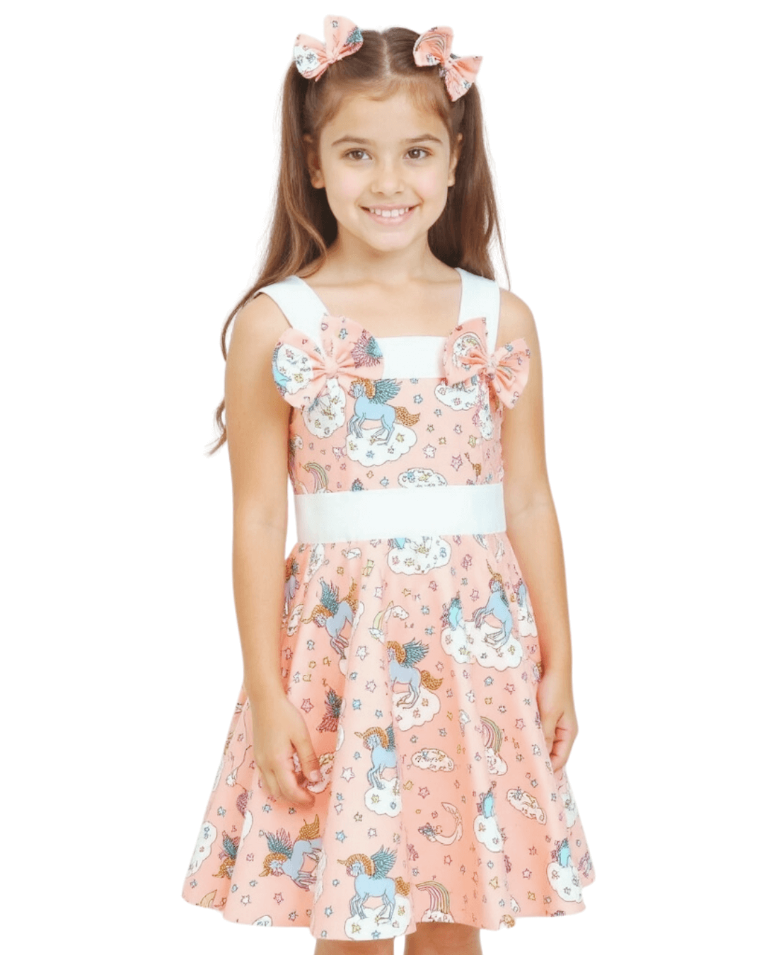 Girl wearing a Peach Unicorns Rockabilly Dress with bows, featuring bright unicorn prints on a playful circle skirt.