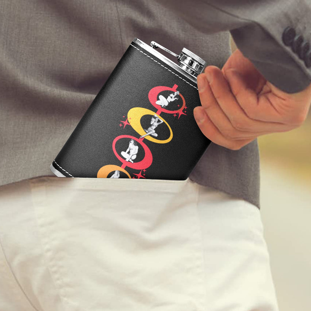 Man placing a Poison Arrow Retro 8 oz black hip flask with pin-up girls design into his pocket.
