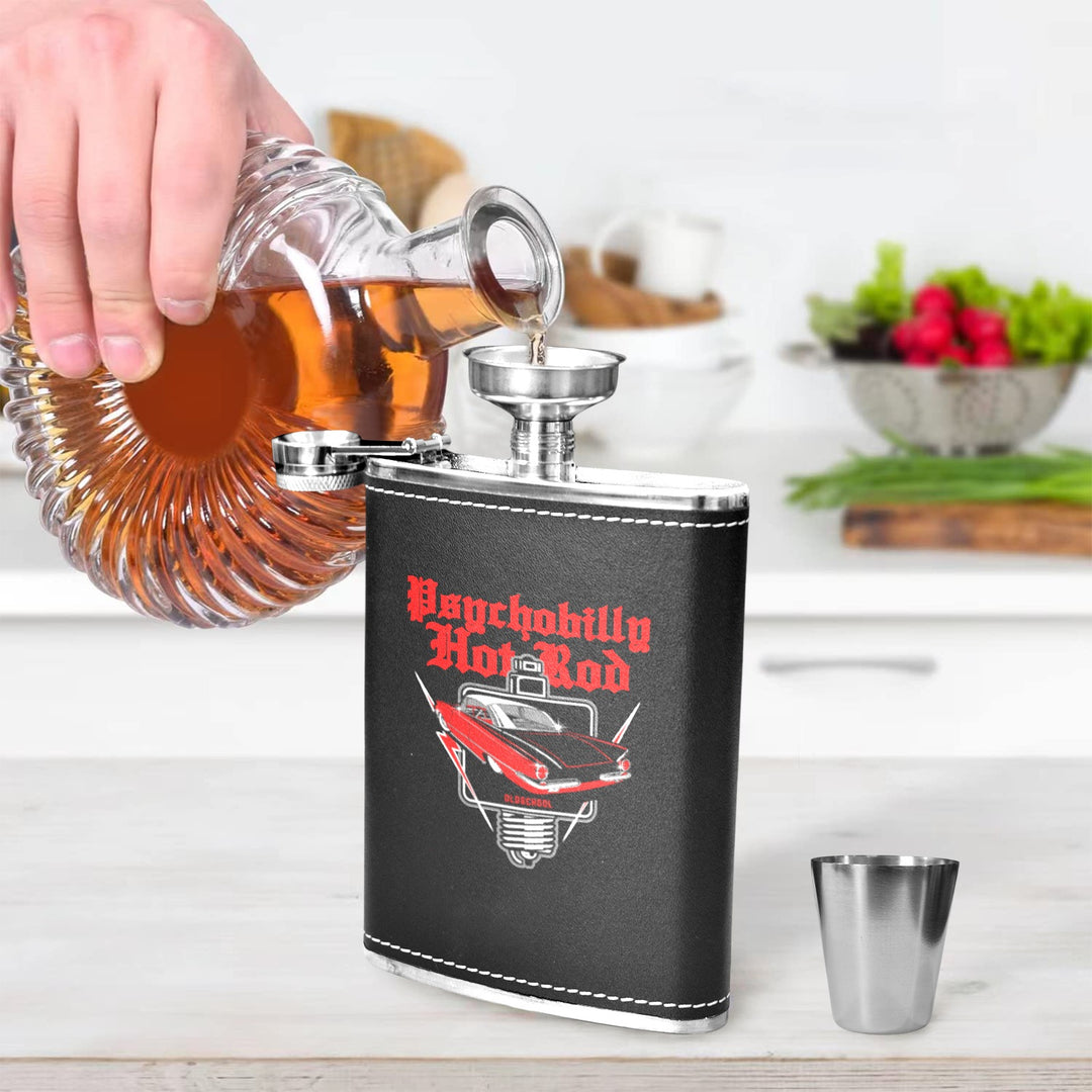 Pouring whiskey into a Psychobilly Hotrod 8 oz black hip flask in a modern kitchen setting.
