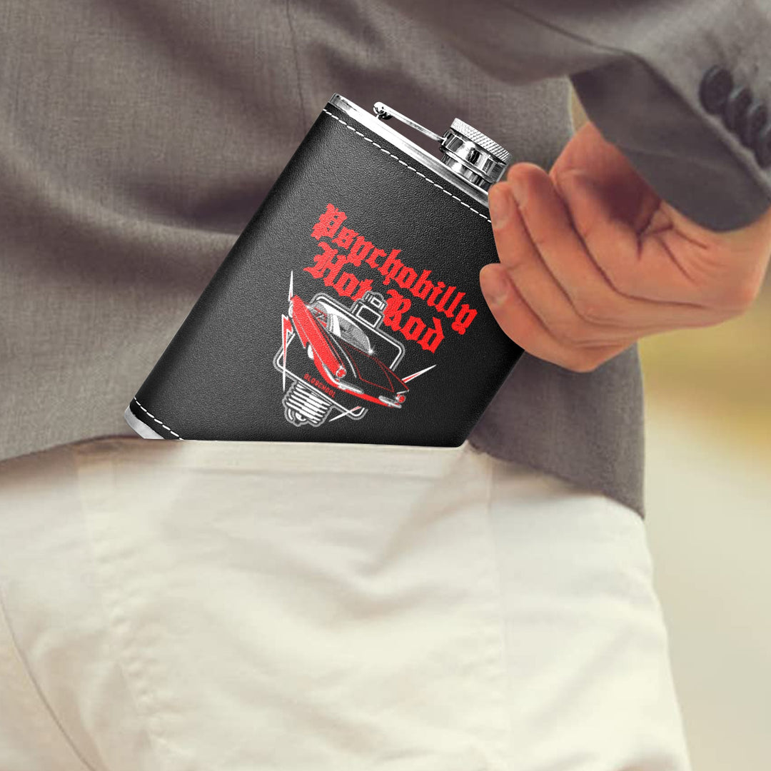 Psychobilly Hotrod 8 oz black hip flask tucked into the pocket of a gray blazer, showcasing retro design.