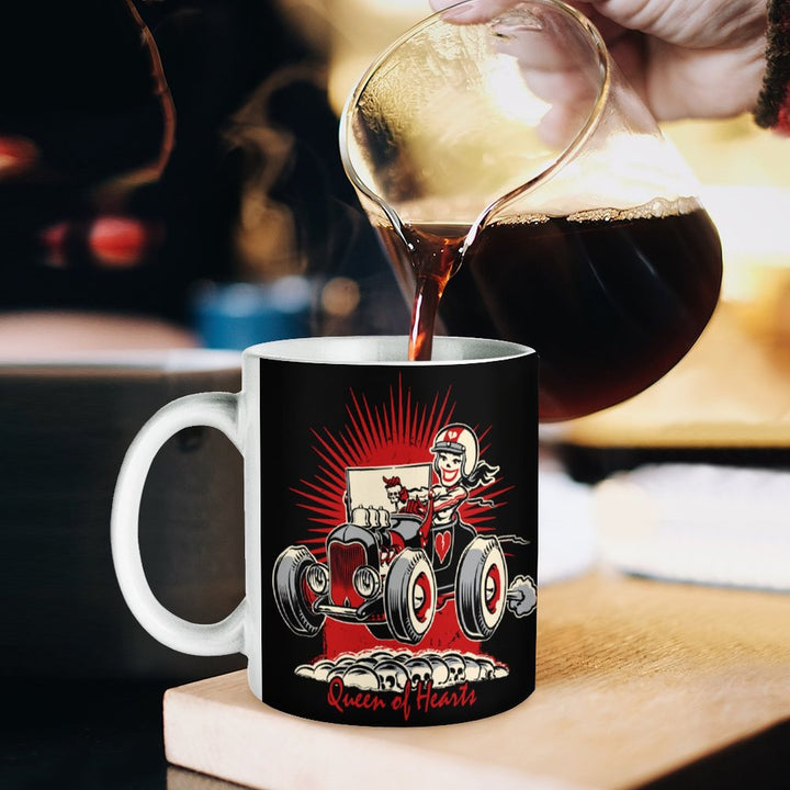 Queen of Hearts retro coffee mug being filled with coffee, showcasing vibrant design and durable ceramic material.