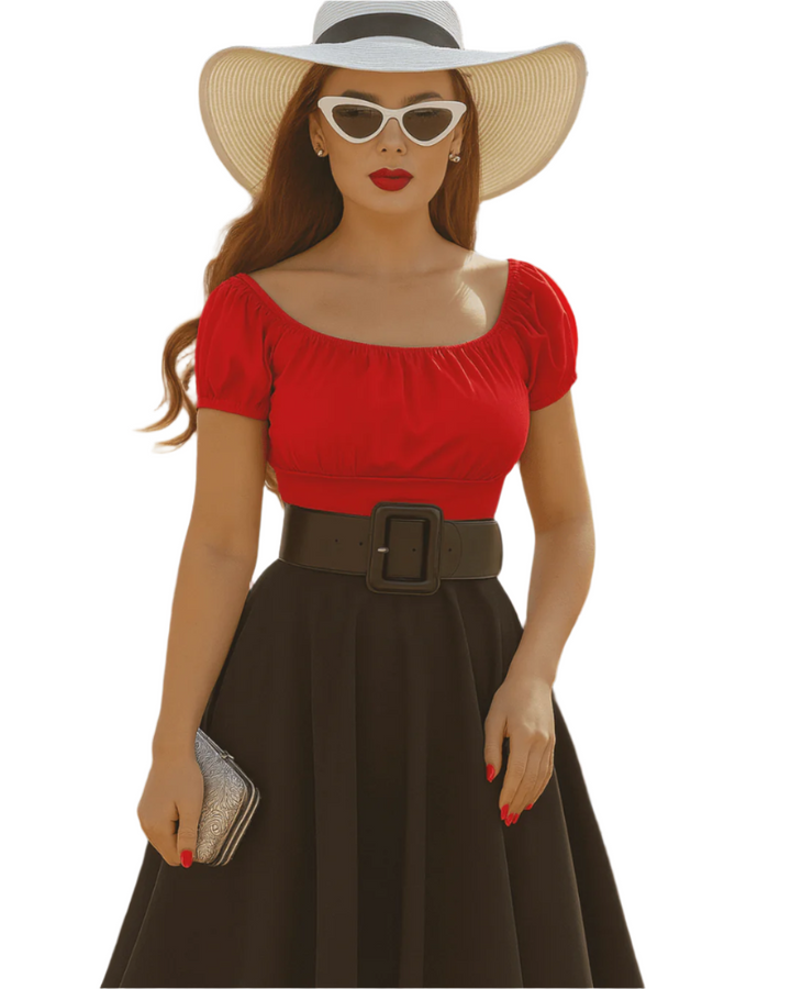 Woman wearing a red top and brown skirt with a wide-brimmed hat on a white background