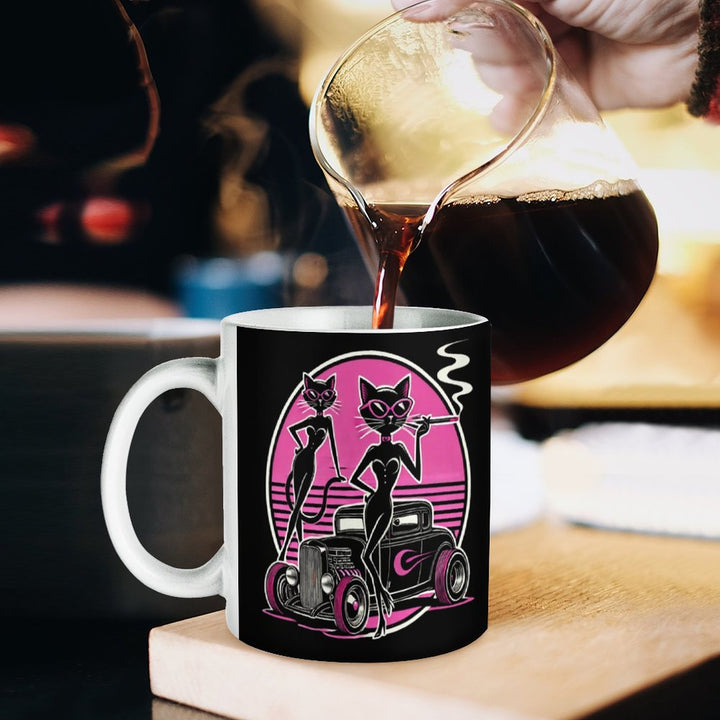 Retro coffee mug with stylish cat graphic being filled with coffee, perfect for enjoying your favorite brew.