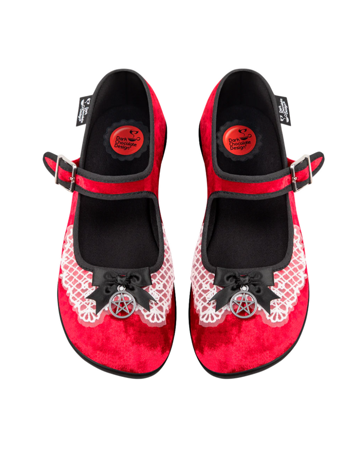 Red and black shoes with lace details on a white background