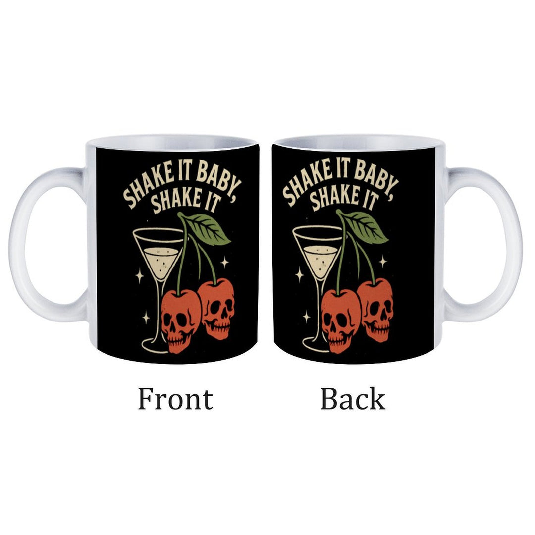 Shake It Baby white ceramic mug featuring skull and cherry design, perfect for coffee or tea.