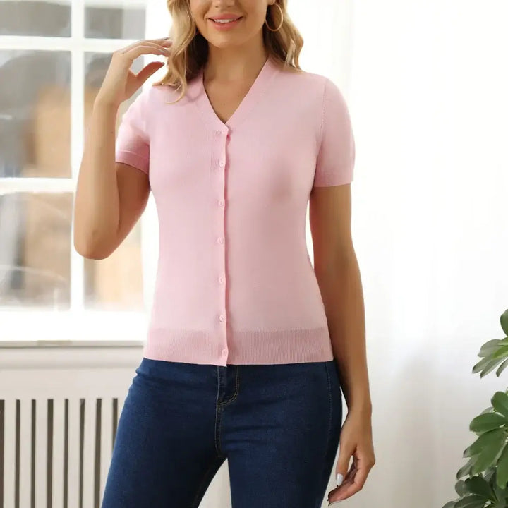 Short sleeve pink V-neck button-up cardigan perfect for layering and a polished look in warm weather.