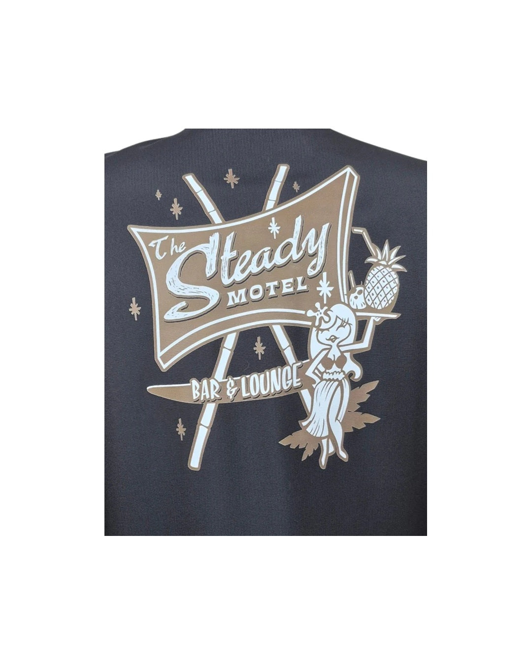Close-up of the Steady Motel Bar and Lounge back print with hula girl, pineapple cocktail and starbursts
