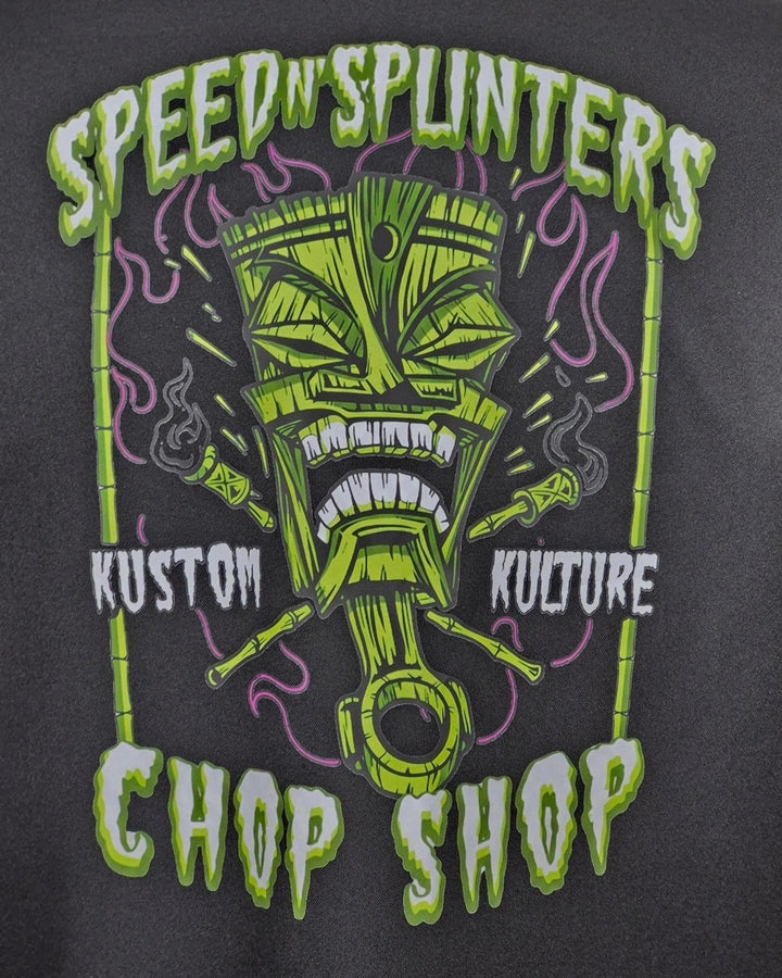 Close-up of Speed N Splinters Chop Shop tiki and piston back print in lime, purple and white