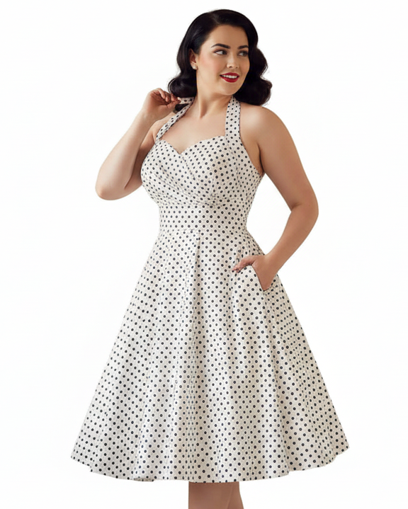 White vintage-style women’s halter dress with black polka dots and full swing skirt
