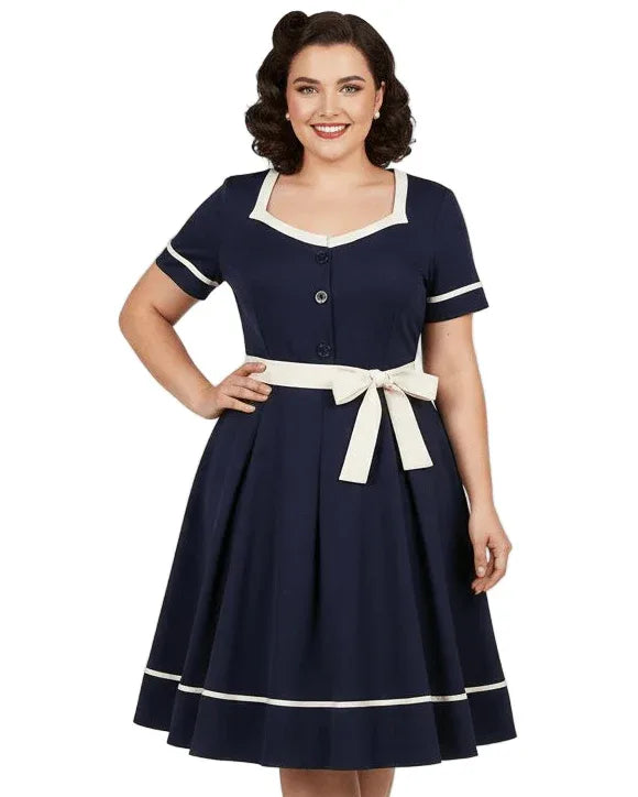 Navy blue vintage-style women’s fit and flare dress with short sleeves, button front and contrast waist tie
