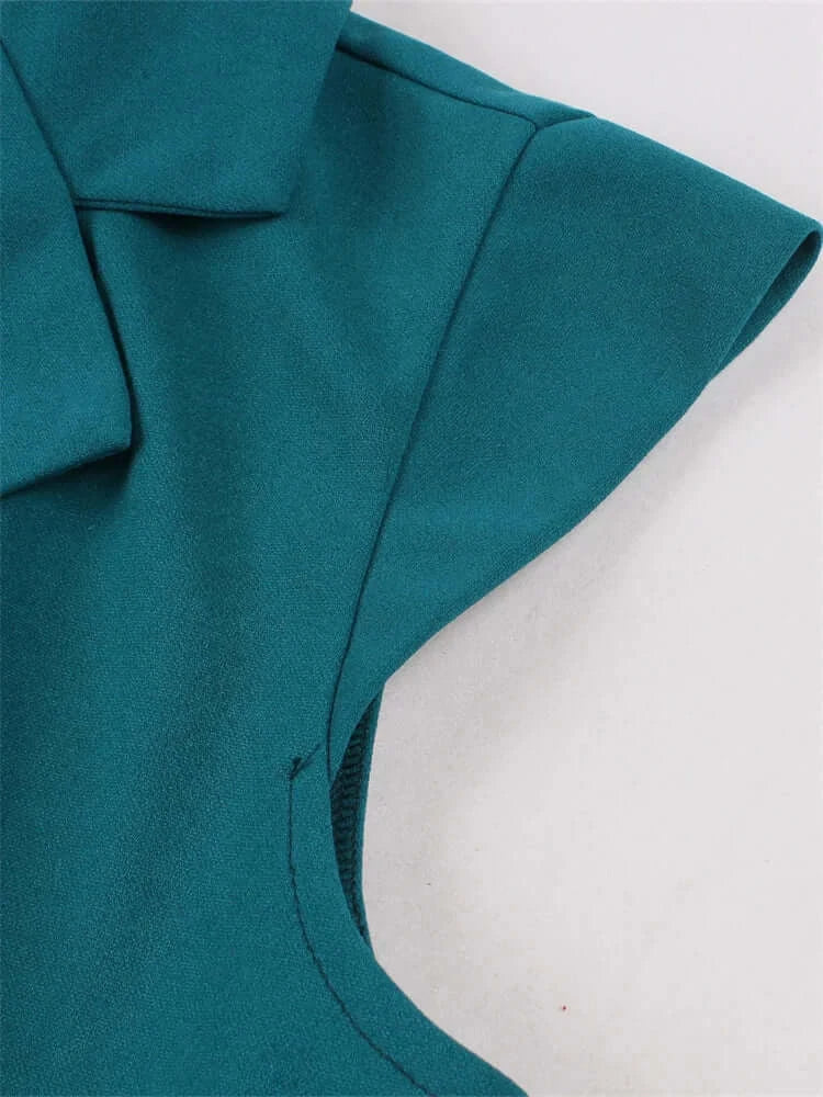 Vintage Teal Swing Dress With Pockets close-up view of collar and shoulder detail