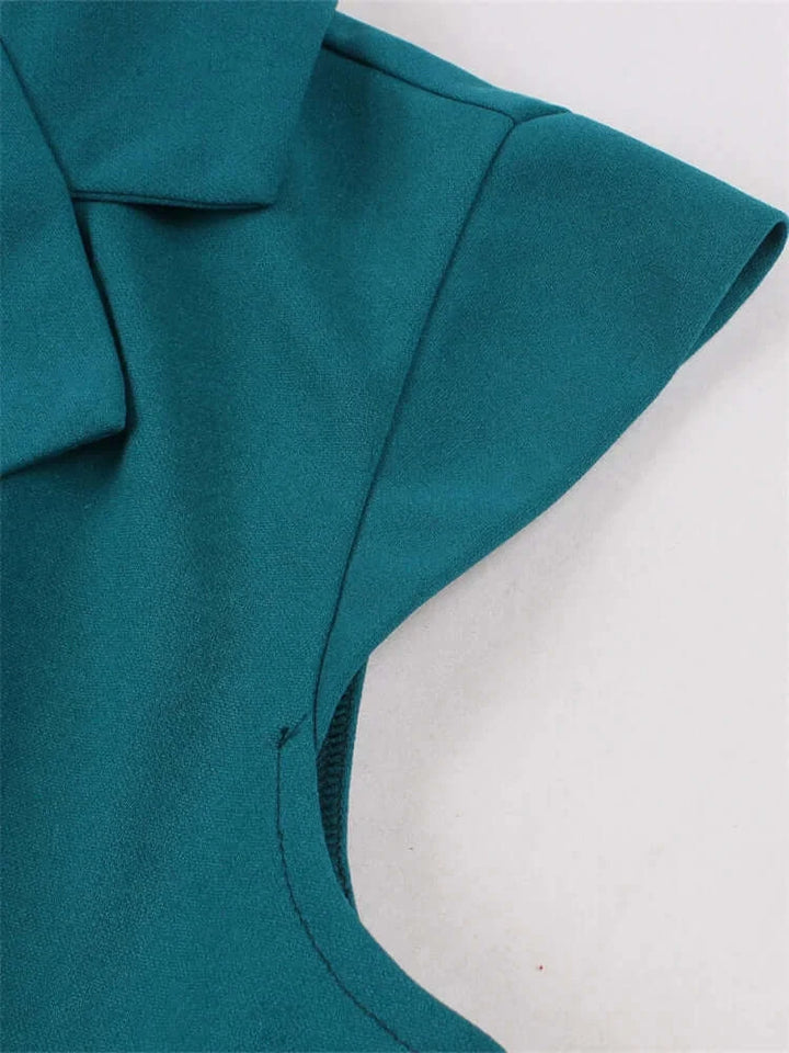 Vintage Teal Swing Dress With Pockets close-up view of collar and shoulder detail