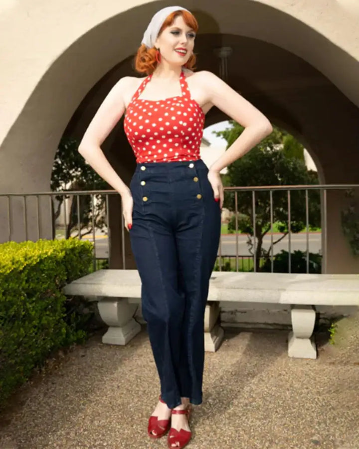 Vintage Wide-Leg Jeans [IN STOCK] modeled with a polka dot top, showcasing high waist and button detail in a stylish outdoor setting.