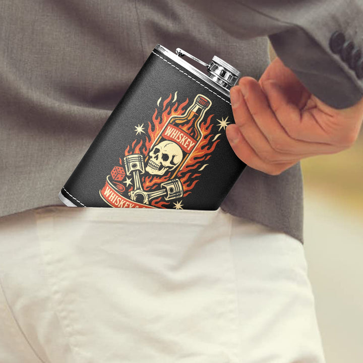 Black hip flask with whiskey skull design, tucked in a man's pocket, perfect for whiskey lovers in Australia.