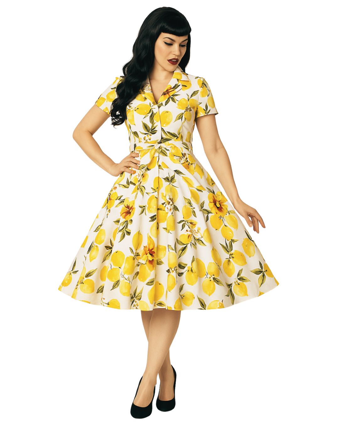Woman wearing a yellow and white dress with lemon print on a white background